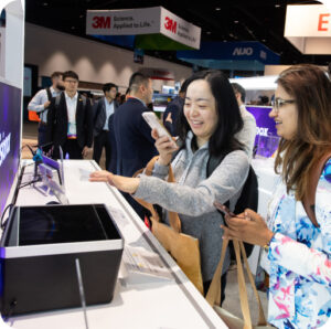 Attendees looking at exhibitor products.